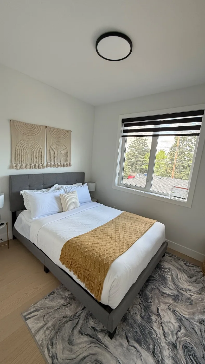 Primary bedroom styled to the listing photos after a clean