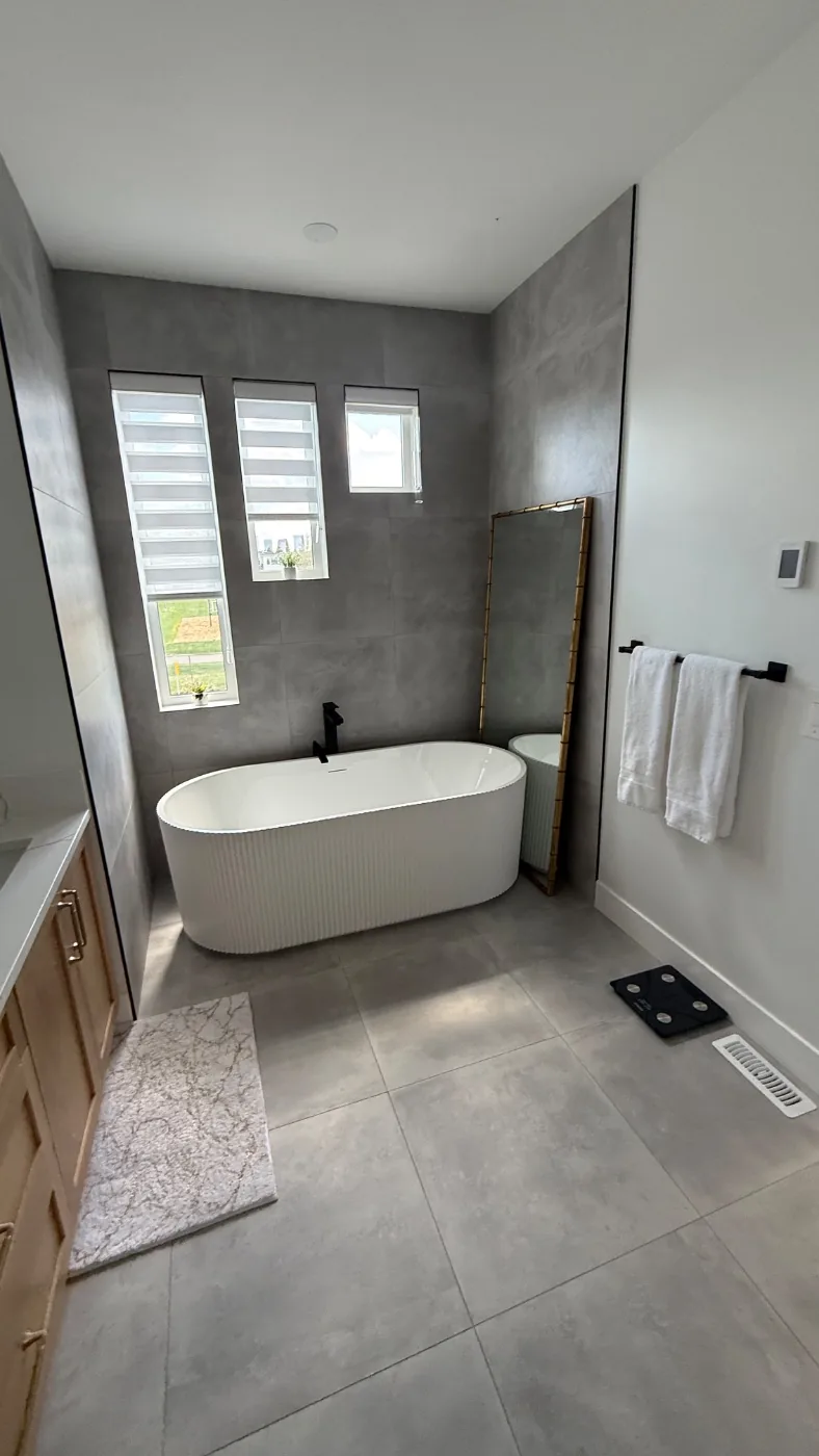 Freestanding soaker tub in a spotless short term rental bathroom