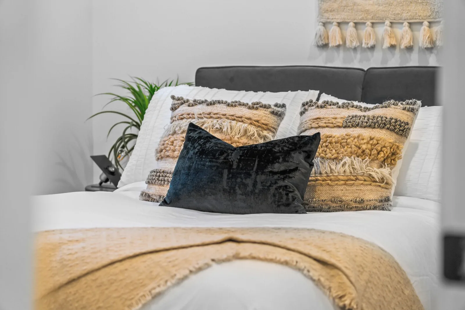 Hotel style bedding in a Calgary short term rental after a turnover