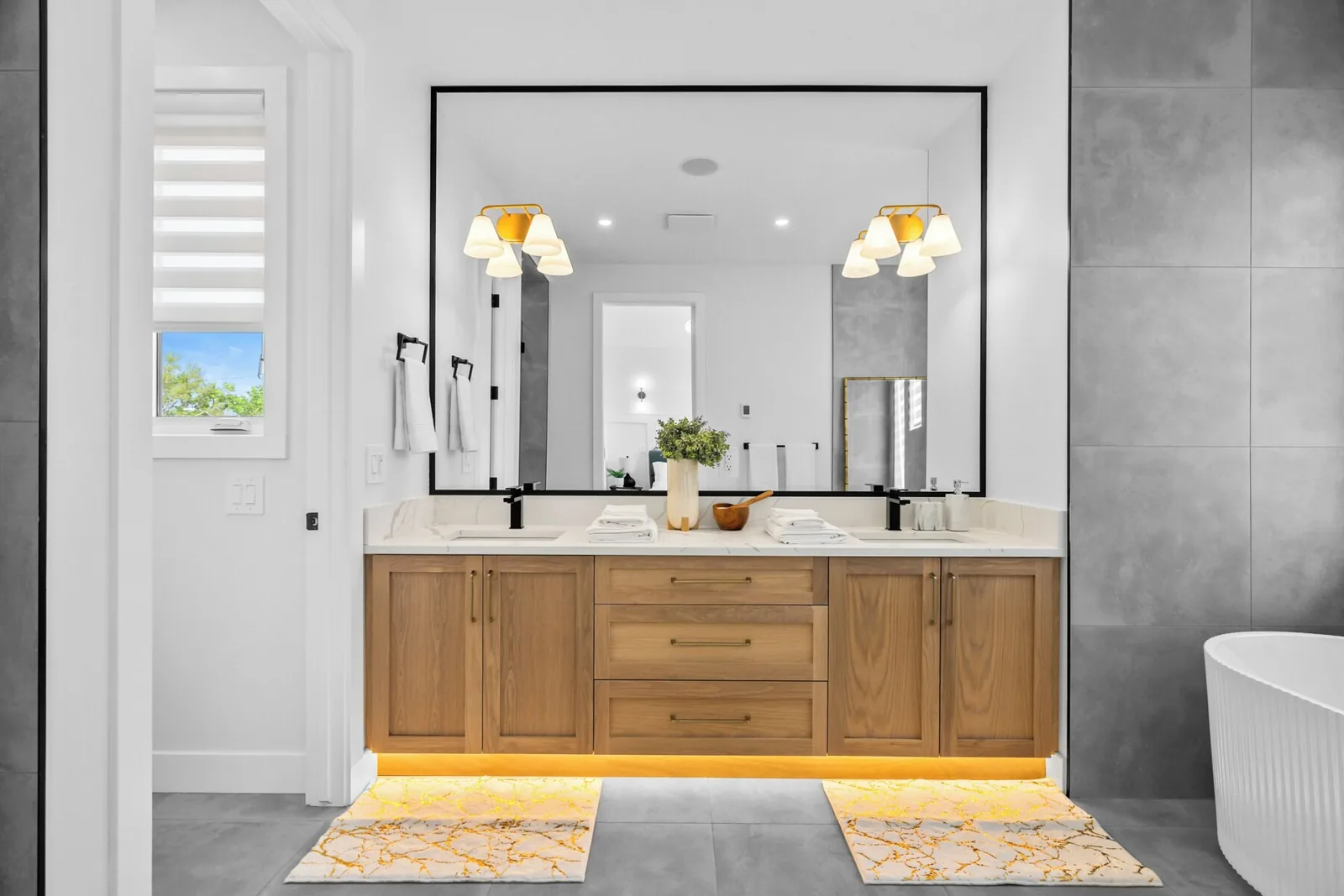 Ensuite washroom with double vanity and soaker tub, cleaned between guests