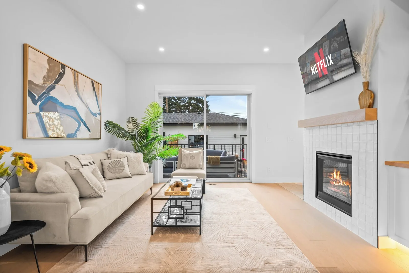 Living space with fireplace staged to the listing photos