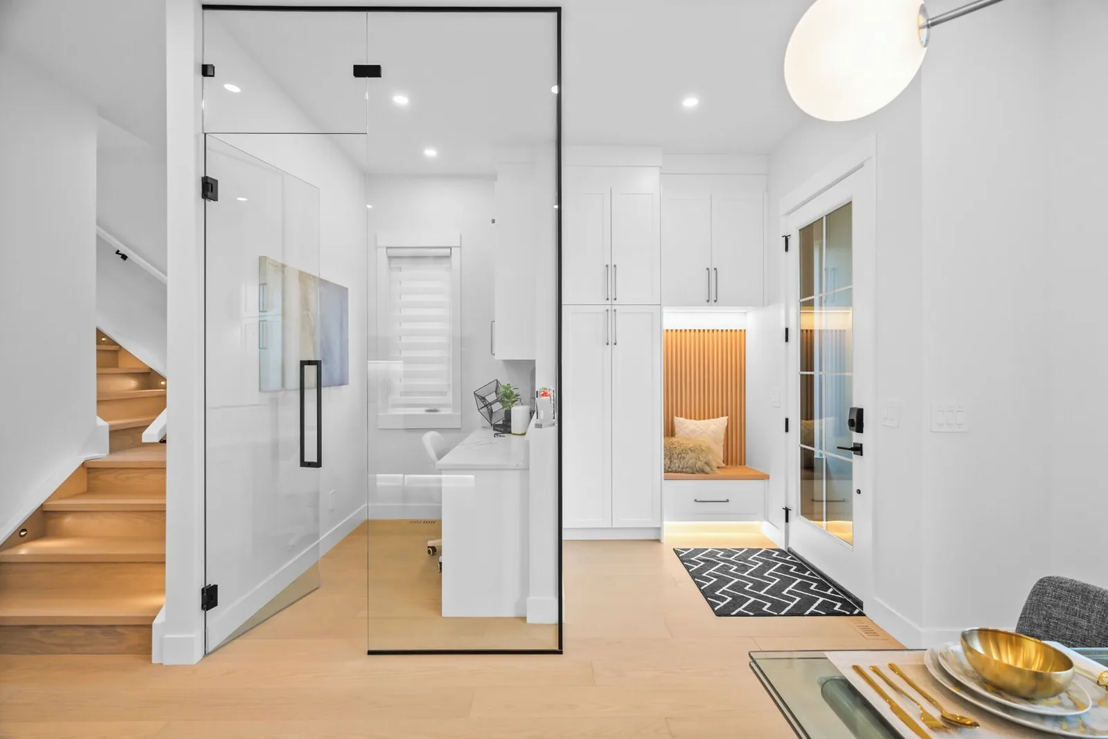 Entry and stairwell with a glass shower beyond, cleaned between stays
