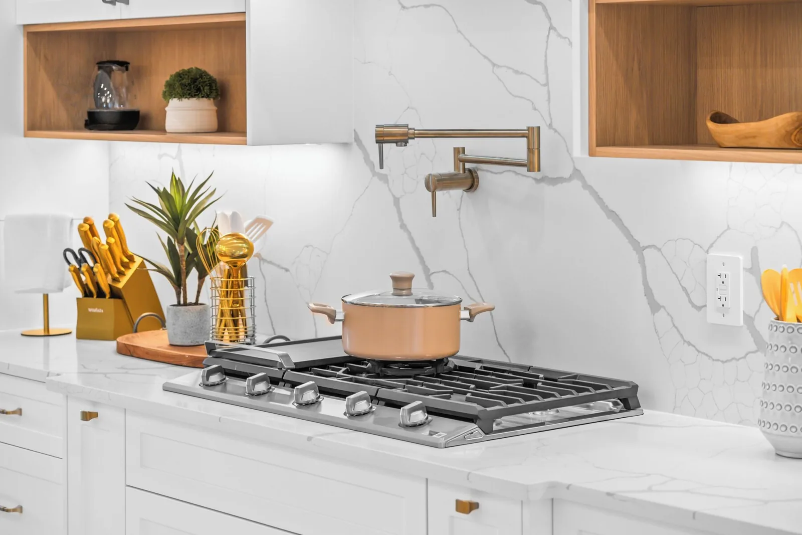 Gas range and marble backsplash wiped down after a turnover